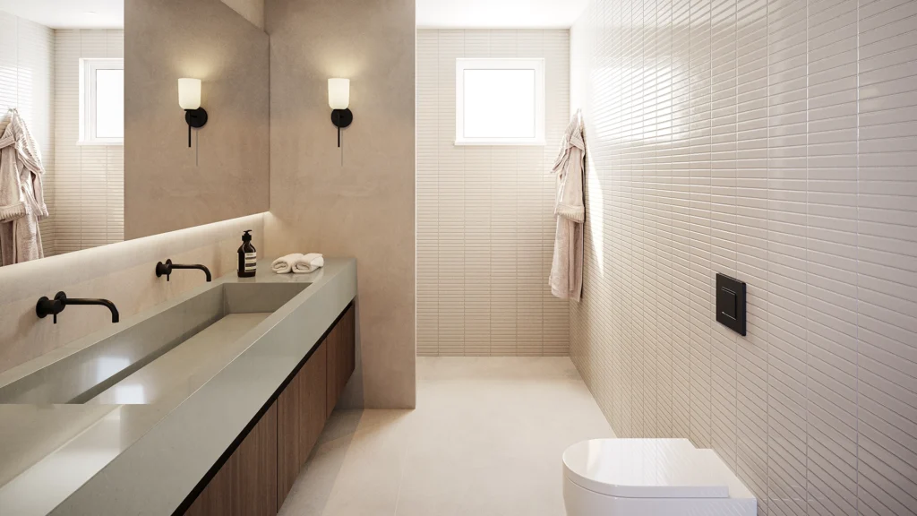 Minimalist bathroom with dual sinks, wall-mounted faucets, robe hooks, and soft wall lighting.