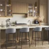 Modern kitchen with wooden cabinets, marble island, four bar stools, and large window.