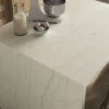 Marble kitchen island with stools, a milk bottle, eggs, and a mixer on top.