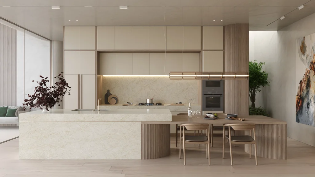 8251_TajWhisper_Render1_1920X1080_RGB-copy-1024x576 Modern kitchen with marble island, built-in appliances, wooden dining table, chairs, and decorative plants.