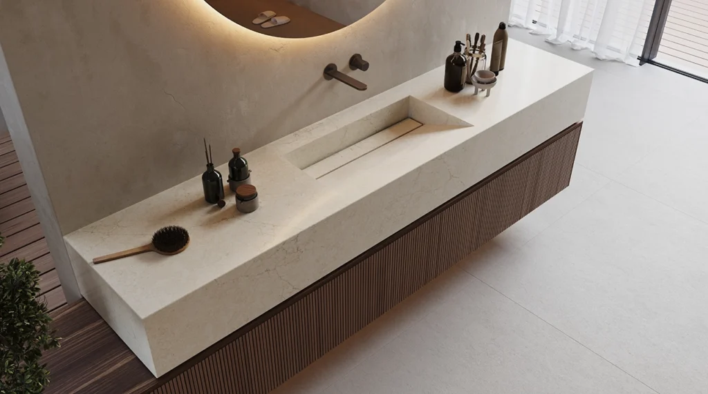 Modern bathroom sink with integrated basin, wooden vanity, round mirror, and grooming accessories.